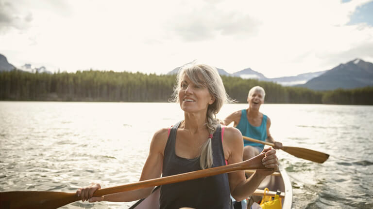 man and woman canoeing