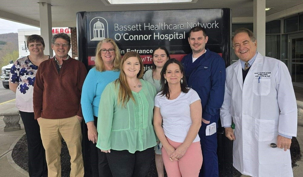 O'Connor Hospital & SUNY Delhi team standing in front of O'Connor Hospital