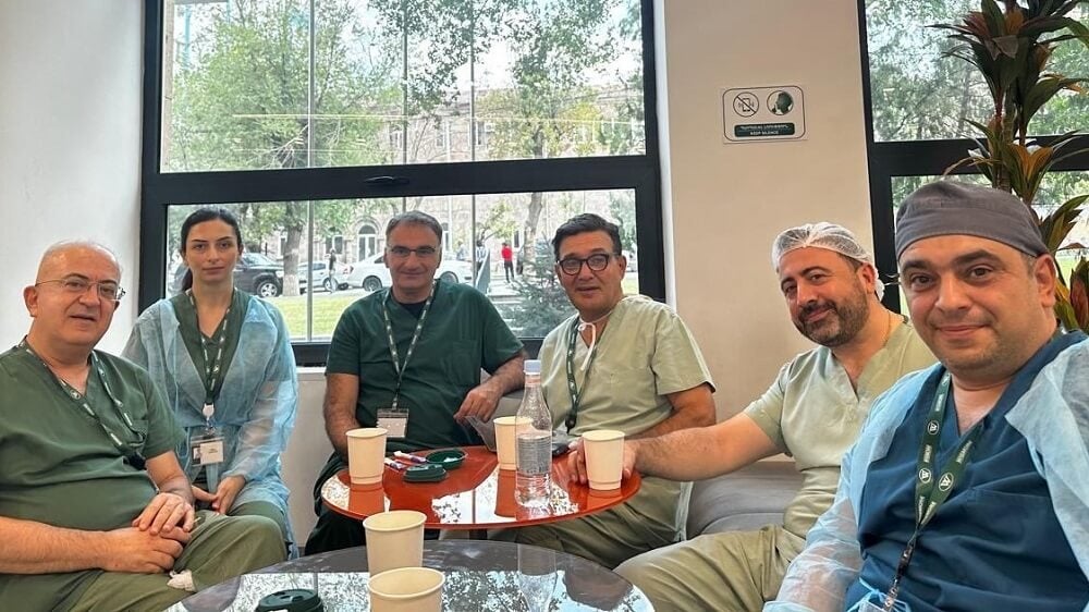 Dr. Badalian eating lunch with colleagues in Armenia.