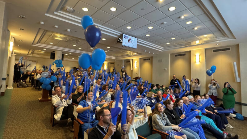 More than 100 employees gather in Bassett Medical Center’s Clark Auditorium on April 23, 2025, to receive news of the hospital’s Magnet designation and celebrate.