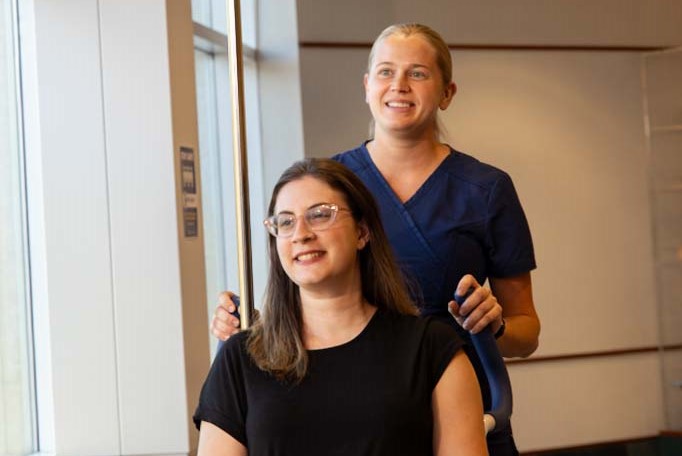 Woman being assisted by CNA