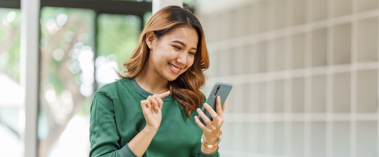 Woman using her phone to connect to electronic health record