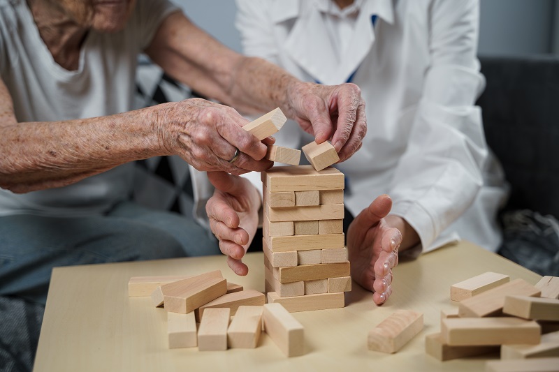 residents playing jenga, socializing