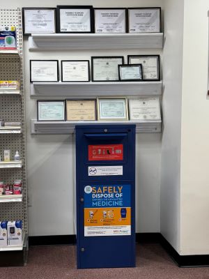 A blue collection kiosk by business certificates 