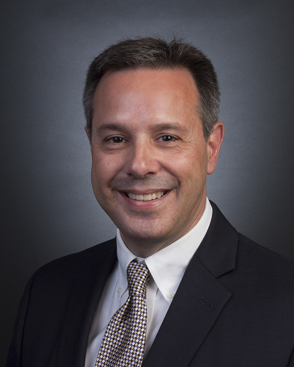 A photograph of Dr. Fredette